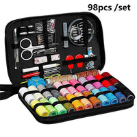 Sewing kit open showing threads needles and accessories